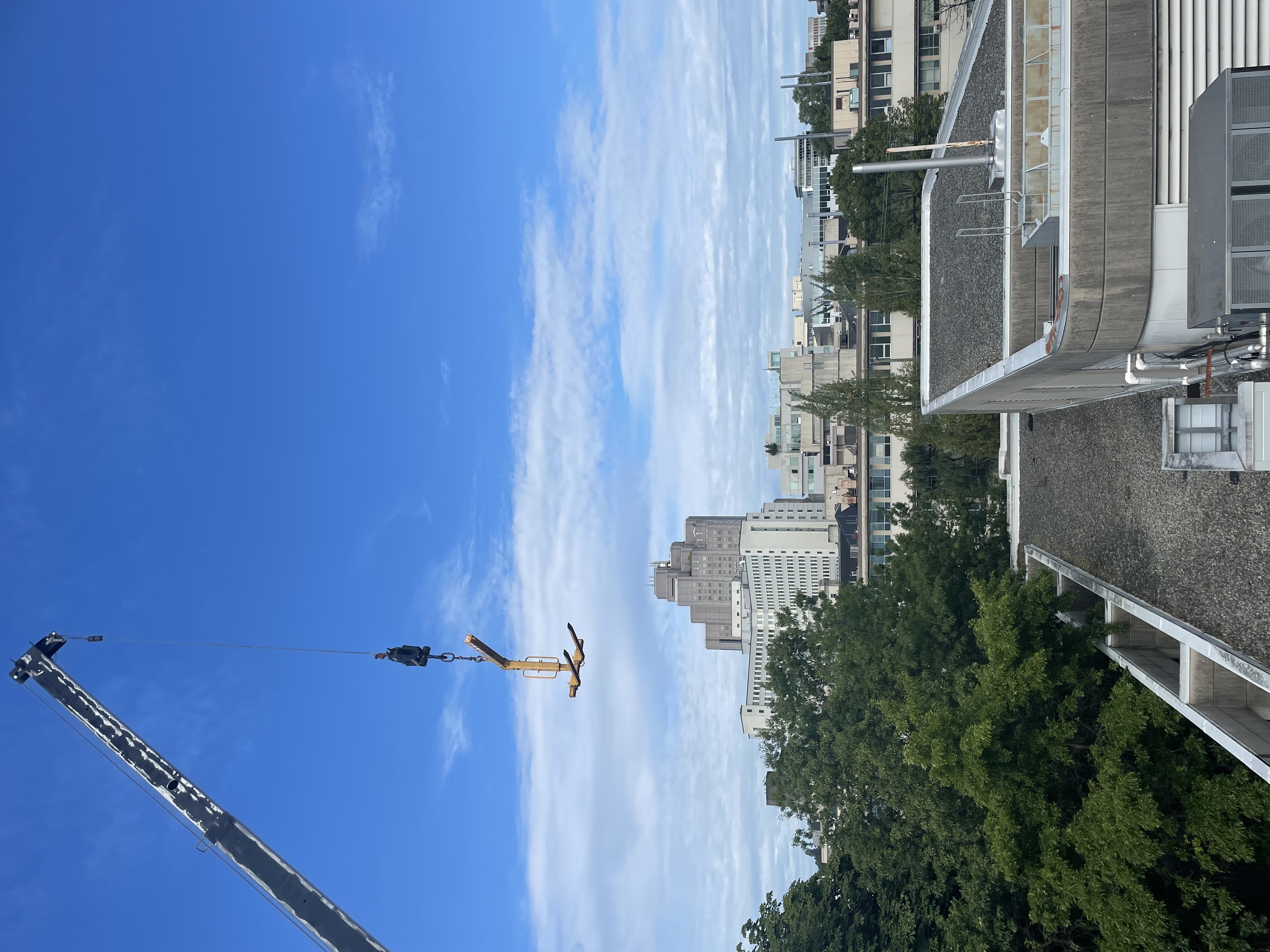 Crane access for equipment placement during cooling tower refinishing at BC Cancer Agency