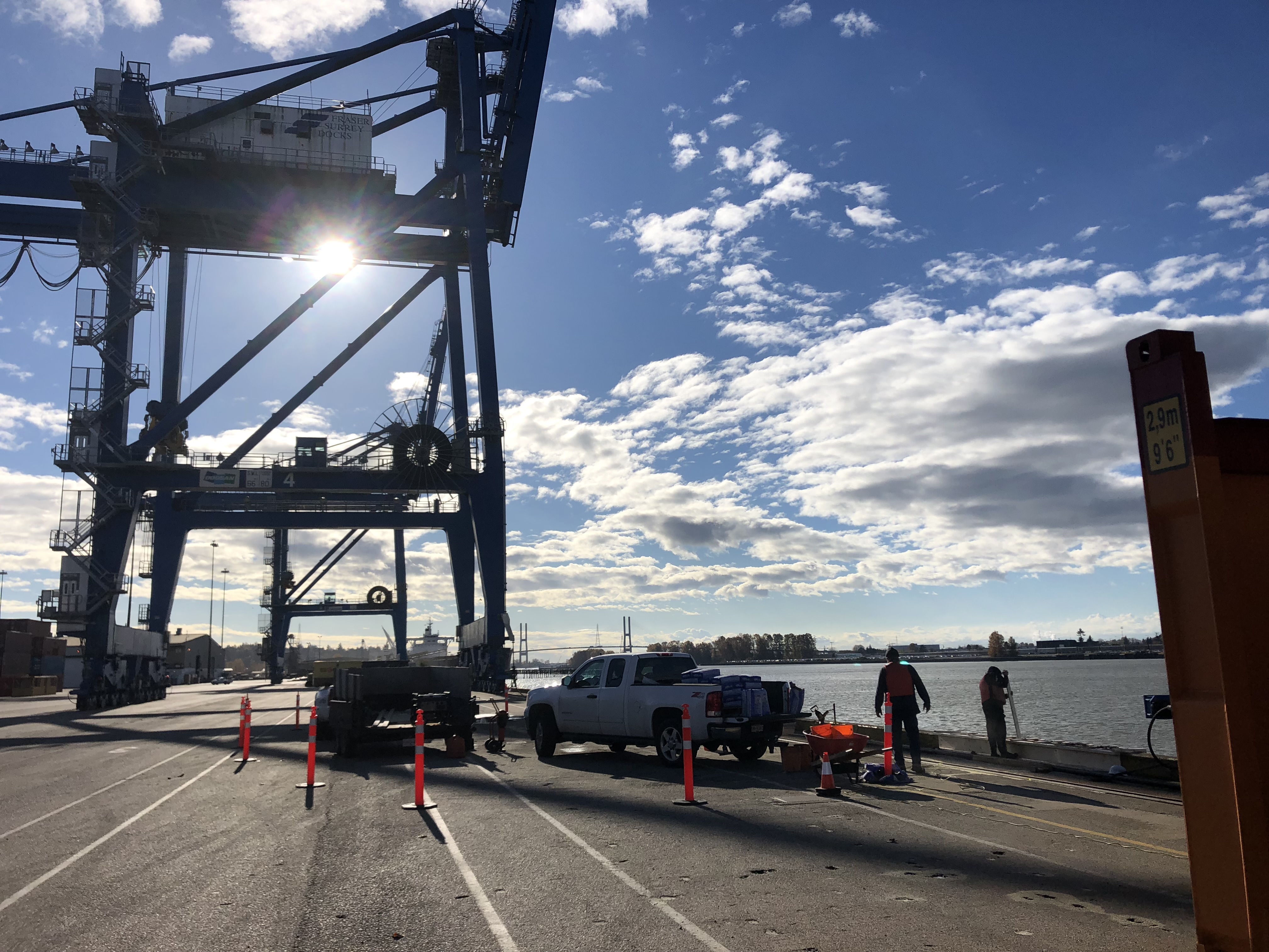 Berth-side fender replacement work underway at DP World Fraser Surrey with marine cargo gantry cranes in background