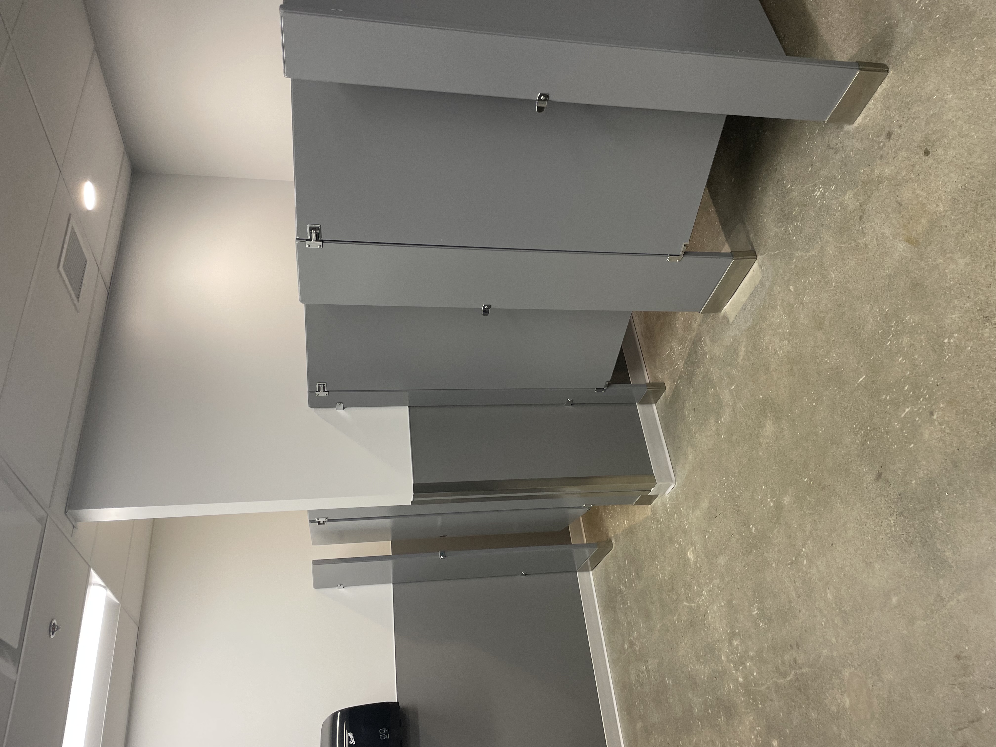 New washroom partitions and finishes in upgraded employee facilities at Finning Canada, Surrey