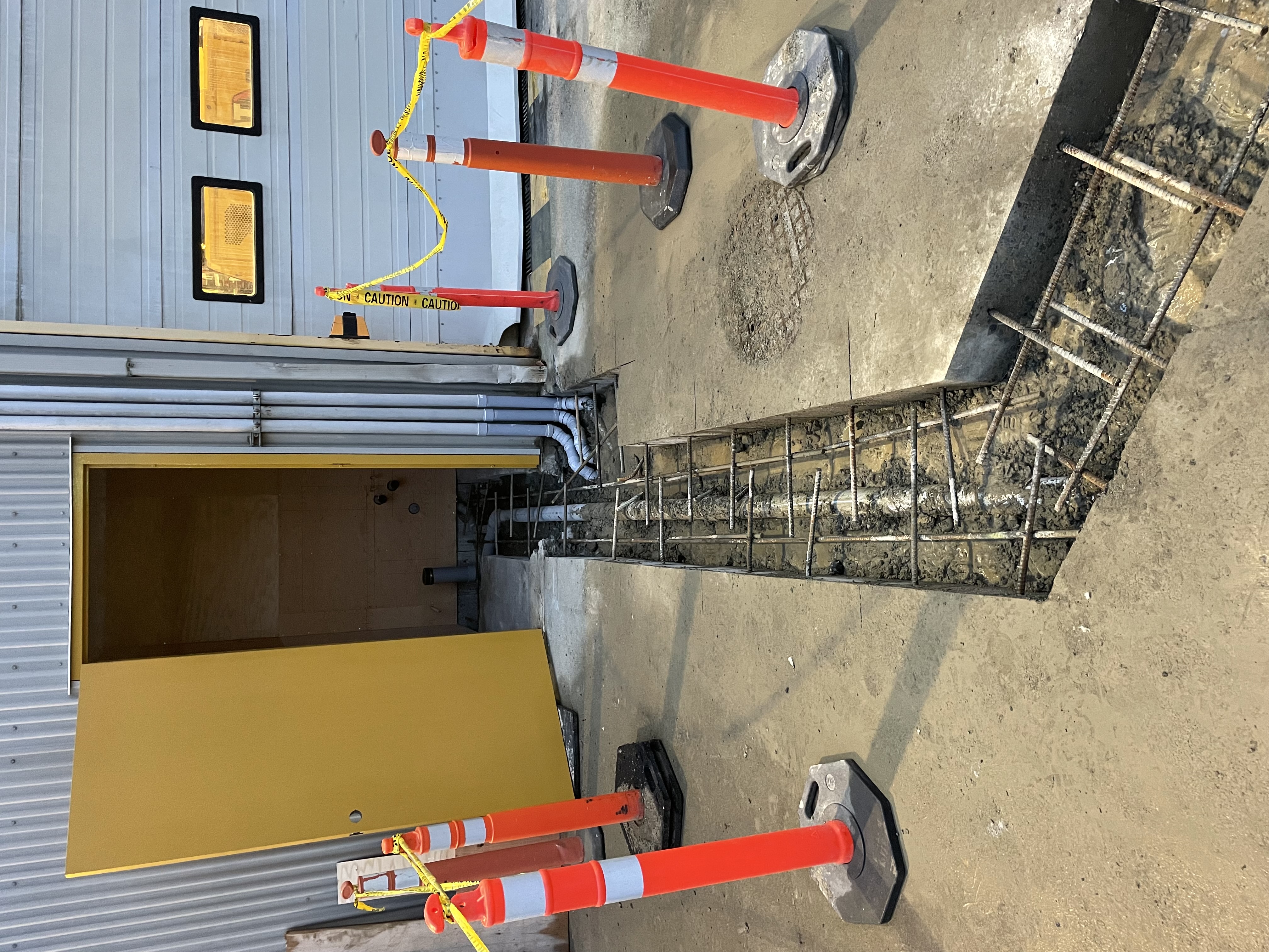 Concrete trenching and rebar preparation for new yard washroom plumbing at Finning Canada’s Surrey facility