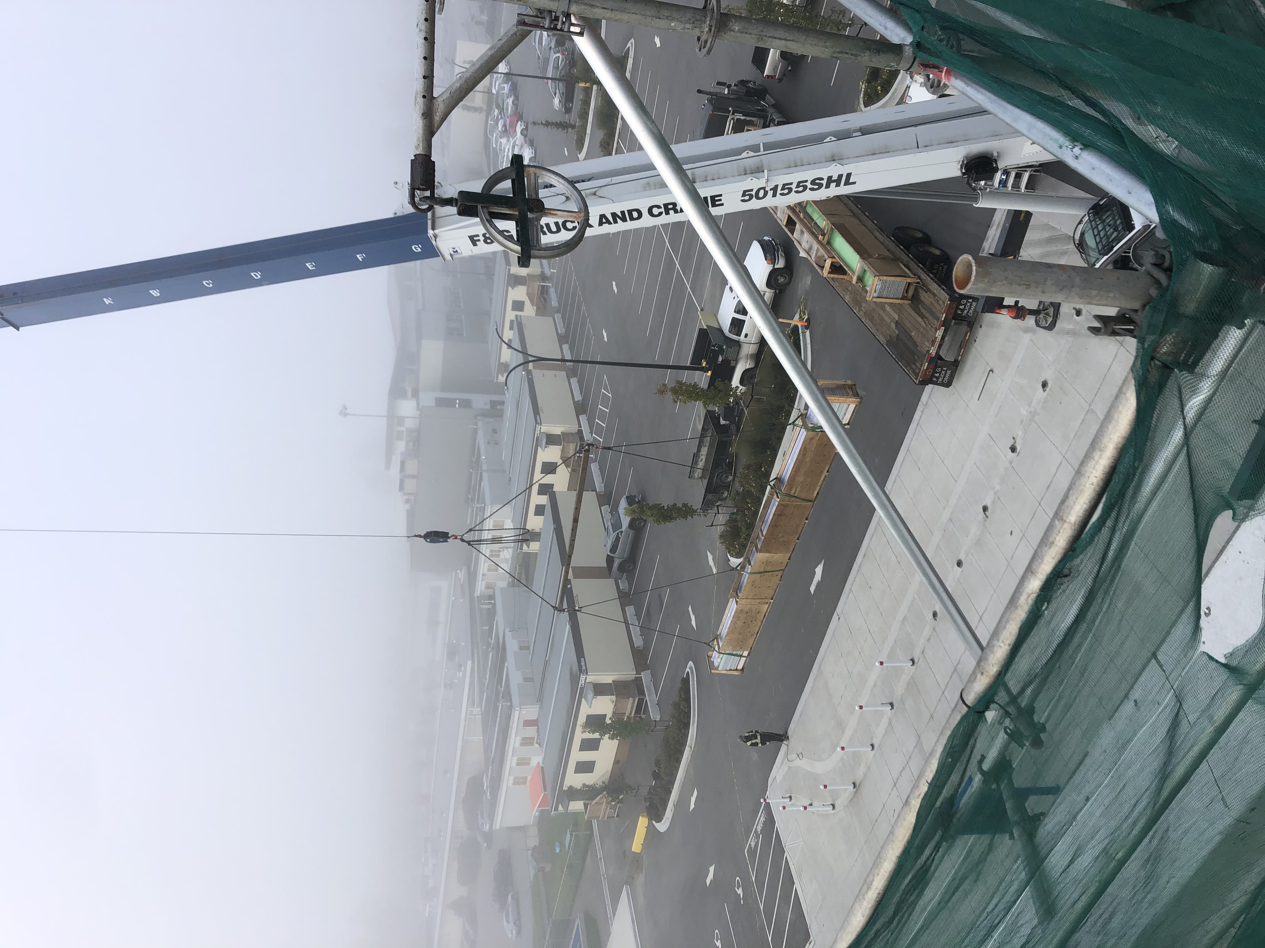 Crane operations during skylight panel installation at McLeod Athletic Park