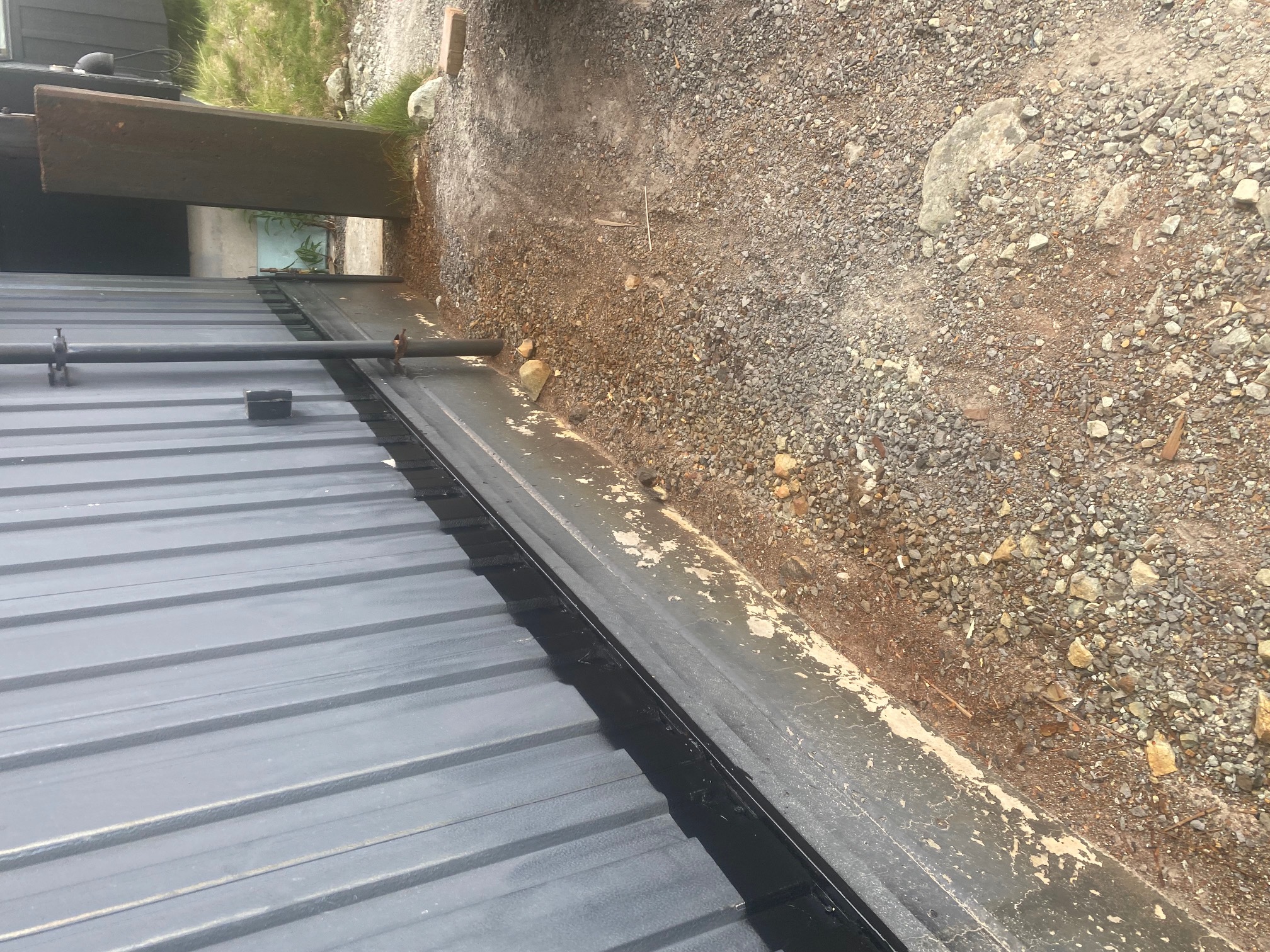 Detail of metal roof and flashing repairs at Telus equipment shelter at Blackcomb Rendezvous